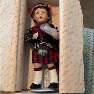 Plaid Scottish Piper porcelain doll